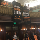 Protesters dropping banners from the City Hall balcony